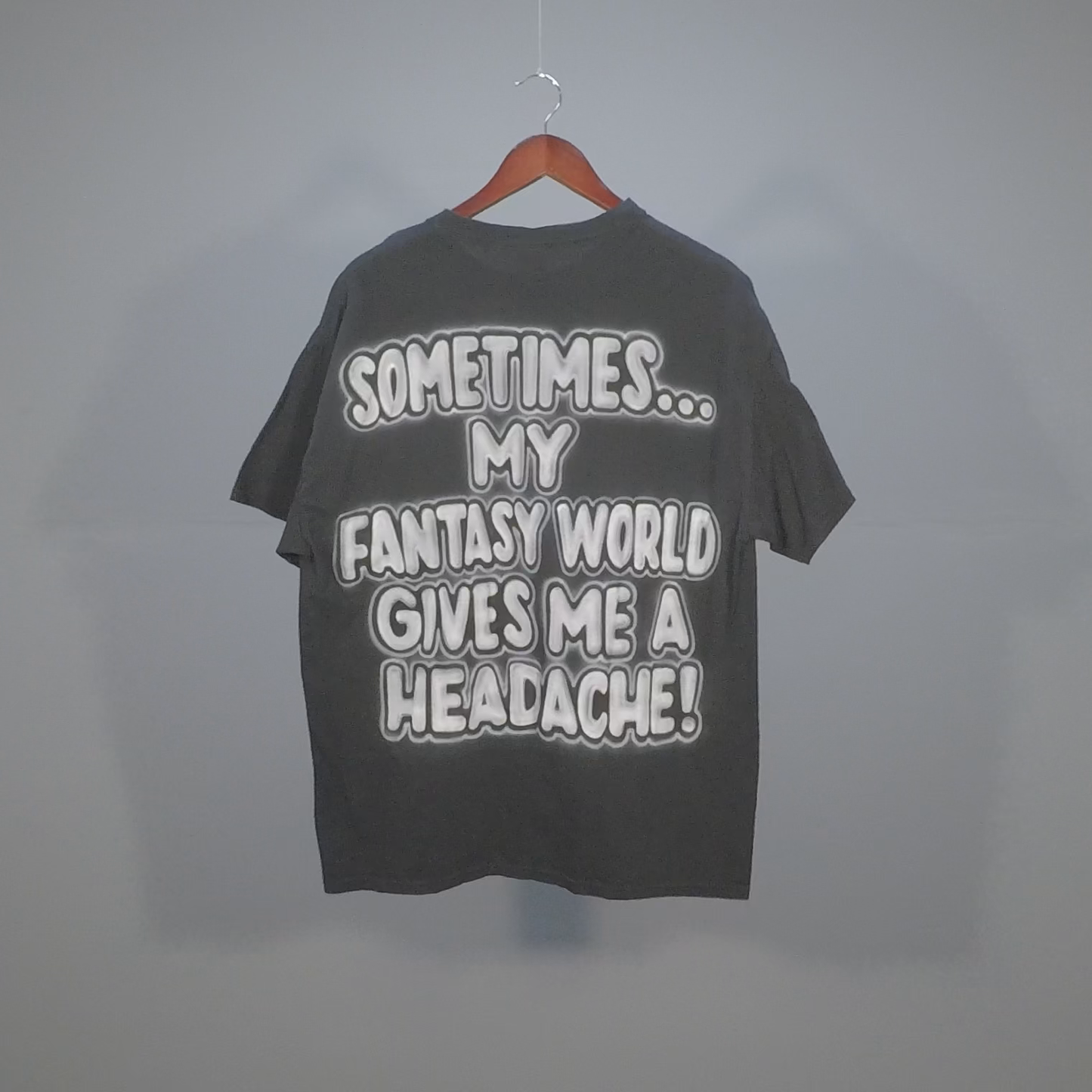 "Sometimes My Fantasy World Gives Me a Headache" Airbrushed Tee